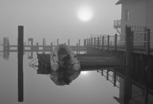 Inflatable Dinghy in Morning Fog - Still Waters