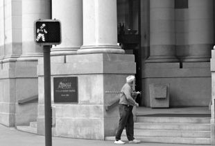 Poor man searching a place to spend the night