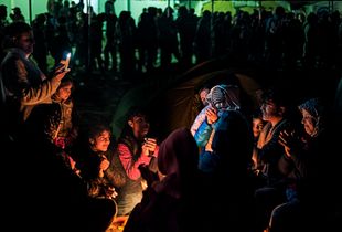 Resilience - singing around the fire in Idomeni refugee camp (March 2016)