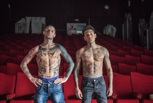 A portrait of Alessio and Diego in an empty movie theater