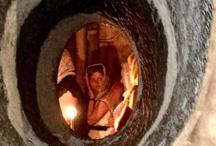 Woman waiting for a blessing inside the Church of the Holy Seplechure, the Old City, Jerusalem