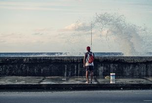 Streetlife of cuba series, fisherman on the malecón of havanna