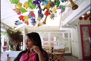 Sahomy, her daughter back home with her parents, in the first month of a six-month work contract in St. Maarten