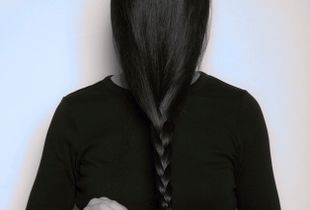 Spontaneous sleight of hand: RaeLyn  braids her hair during a portrait session in 2014.