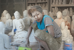 Dust covered child labourer at workshop in Mandalay, Myanmar.