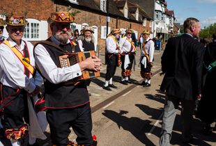 Morris dancers wait to join the Shakespeare Birthday Celebration Parade. They will join after King Edward VI School, who started celebrating the day decades ago.