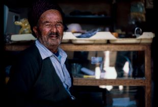 A Kurdish  man With traditional clothes In his own shop from Hawraman Takht ,Kurdistan of Iran
