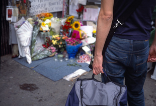 Mourners at the corner of Stockwell Tube station in London the day after the fatal shooting by police of Jean Charles de Menezes suspected of being a terrorist bomber later found to be a case of mistaken identity.