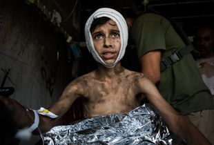 He was the only child to make it out alive. He was carried out by a surrendering ISIL fighter.