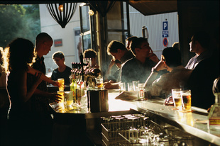 Busy bar scene in Montparnasse, Paris