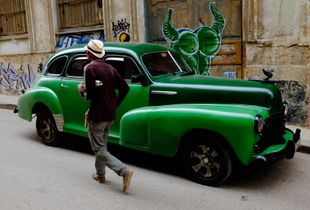 Vintage green sedan in Old Havana, Cuba