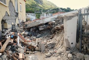 The totally collapsed house where Ciro and his two little brothers were rescued.