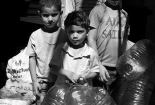 Palestinian refugee children on their way to buy water. Mar Elias Camp, Beirut, Lebanon. 2018.