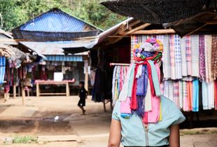 Karen woman walking in the village