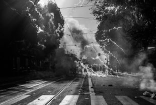 Riot police fires tear gas canisters in the central Labicana street against the  rioters during the urban guerilla triggered by violent fringes. Rome, Italy. 15 October 2011. © Riccardo Budini / UnFrame