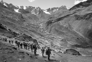 A group of pilgrims follow the procession of the sacred images, which have left the sanctuary in order to return to the town in which they reside throughout the year. This is a 24-hour procession at very high altitudes.