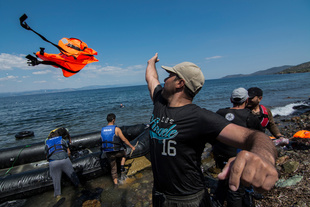 A refugee throws away his life jacket after making the crossing from Turkey to Greece. More than 30,000 refugees have reached the Greek island of Lesvos during August 2015, according to Amnesty International. August 25, 2015, Lesvos, Greece