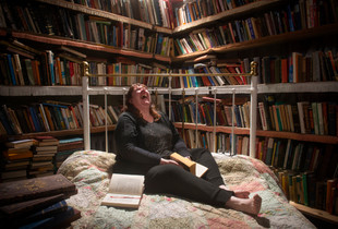 My sister Kerri,  in bed with a book - her happy place