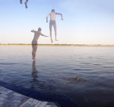 Boys jump into the Ganges