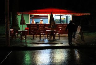 A quiet rainy night at the snack stall.