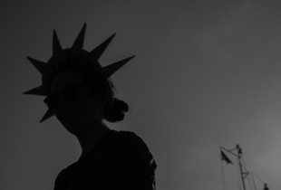 Woman disembarking from “Miss New York” ferry, July 2023.