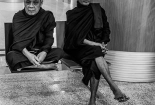 Buddhist Monks waiting for their flight back to Myanmar (Burma) from Thailand.