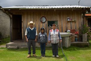 Jesus with his grandparents Pedro and Edgar in front of their house at Llano Grande , Oaxaca/ Mexico