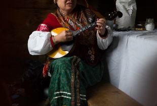 A vibrant Dombra player at the Fort Ross Annual Harvest Festival.