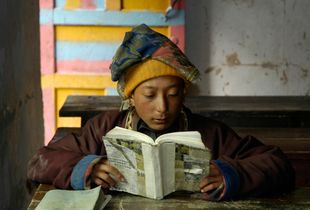 Nomad boy reading, Ponru School, Kham, Sichuan. China. 2005.