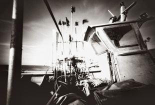 old boat and flags in the wind