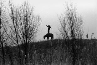 Cossack Valerka. Standing in all growth in a saddle