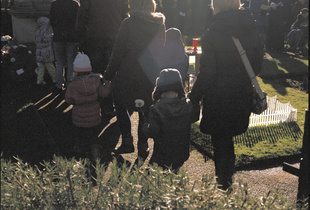 Child With White Poppy. Remembrance Day, East Bierley, Bradford. UK. Sunday 08 November  2015