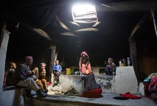 A Wakhi family inside a typical Wakhi house.