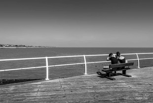 Couple sitting on Clacton on Sea pier