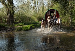 Bryony rides through Brookhouse Ford, Preston Bagot, England on the way to the Beltane Bash 2018