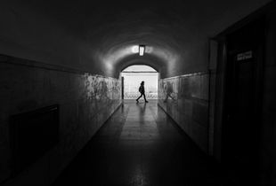 'One of Several Connecting Tunnels Between Opposing Direction Platforms; World's Deepest Metro Station'