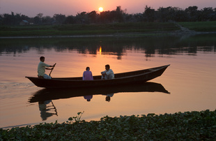 Man rowing couple for a romantic moment along the riverSavar waterfront near Dhaka, Bangladesh