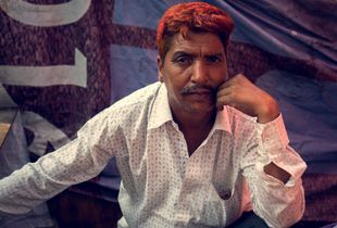 Vendor at a street market, Mumbai, India.