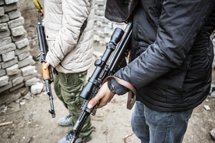 Kalashnikov weapons of YPS guerilla fighters while training between high barricades in Kurdish-dominated city of Nusaybin in southeast Turkey, near the Syrian border. Heavy gunfights took place during several curfews between Turkish government special forces and Kurdish YPS guerilla fighters.