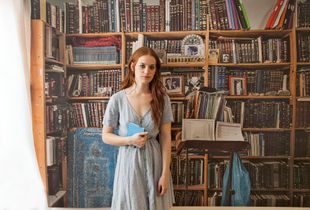 ￼Lea in my studio with a wallpaper of her father books, Berlin, 2019