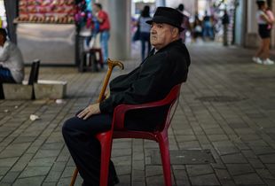 Man in a red chair