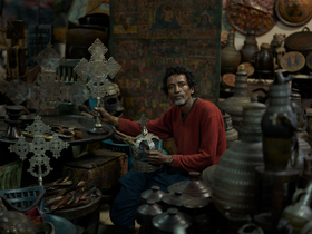 Solomon, an antique dealer with an artifact of almost every location one can journey to in Ethiopia