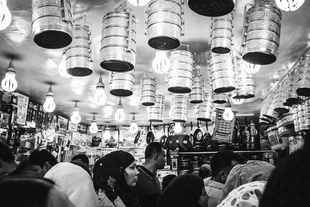 Food carrying boxes hanging from the ceiling at a shop