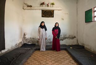 Reem and Noor are sisters in law who share this bare two-room apartment in Azraq with their extended family. The family is struggling to make ends meet and is barely able to afford the rent with the cash assistance and food coupons they receive from UNHCR but they are glad that their young children are now safe. © David Brunetti