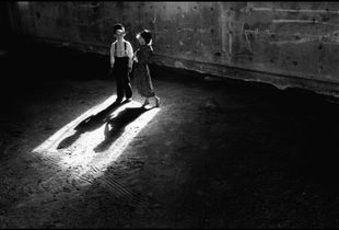 © George Webber - Children in machine shed, 1999