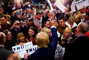 Republican presidential candidate Donald Trump works the rope line during a campaign rally at Pennichuck Middle School in Nashua on Monday, Dec. 28, 2015.