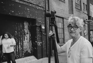 A photographer between head shots