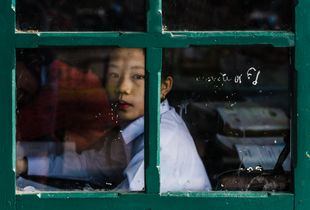 Through the window : a Laotian schoolgirl.