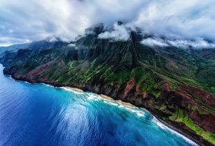 Approaching Paradise/The clouds began to break as we flew over the Pacific towards the Na Pali Coast