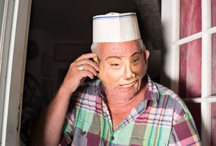 Stuart in his doorway wearing a mask